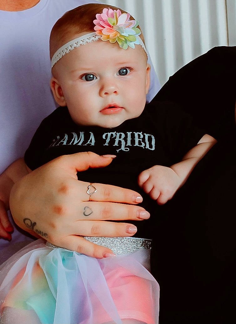 Arrow joined the competition — help win amazing prizes! arm, baby, baby_toddler_clothing, costume_hat, dress, eye, eyebrow, eyelash, finger, gesture, hand, hat, headband, headpiece, headwear, jewellery, pattern, person, pink, skin