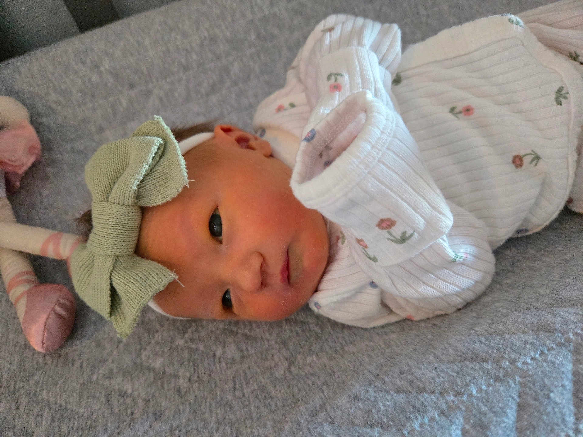 Alice joined the competition — help win amazing prizes! baby, newborn, infant, headband, bow, white_clothing, floral_pattern, blanket, soft_texture, plush_toy, cute, lying_down, face, portrait, indoors, child, sleepwear, small, adorable, resting