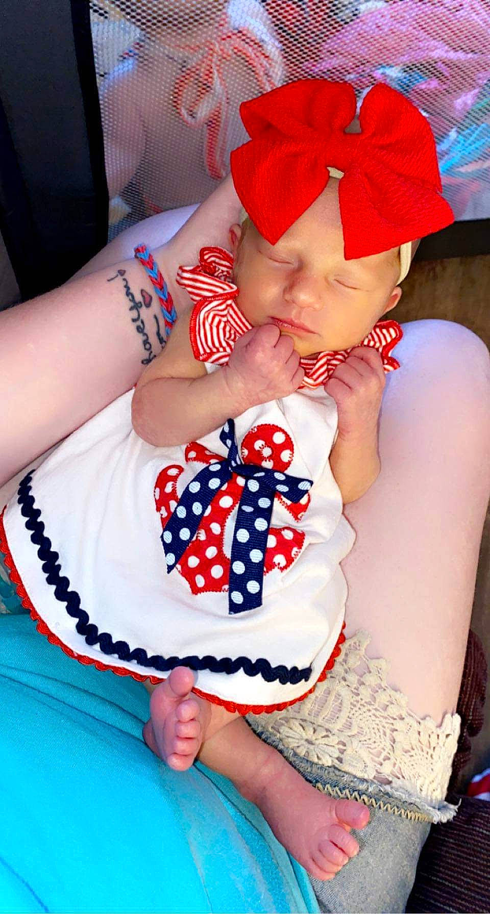 Kyla joined the competition — help win amazing prizes! baby_toddler_clothing, black_hair, blue, cap, cool, dress, fashion, finger, hand, happy, hat, headgear, headwear, human_body, mouth, neck, person, photograph, red, skin