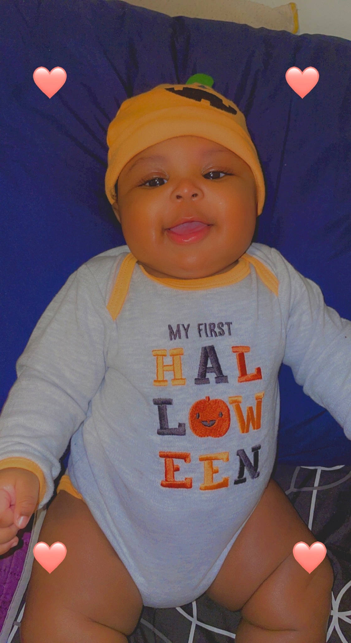 Jonah is registered to the contest to win money with this photo: baby, baby_toddler_clothing, baseball_cap, cap, cheek, child, cool, facial_expression, finger, fun, happy, headwear, mouth, orange, organ, person, product, sleeve, smile, t_shirt