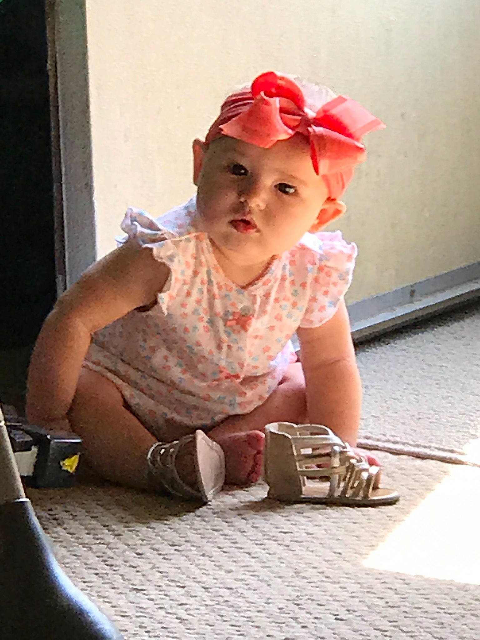 Brooklyn is registered to the contest to win money with this photo: baby, baby_toddler_clothing, cap, carmine, child, fashion_accessory, flash_photography, floor, flooring, fun, hat, headwear, human_leg, knee, pattern, person, sandal, sitting, sleeve, sneakers