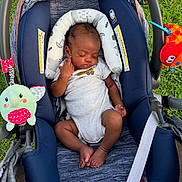Xavier joined the competition — help win amazing prizes! baby, car_seat, child, cute, fabric, grass, head_support, infant, newborn, onesie, outdoor, peaceful, plush_toy, relaxing, resting, seat_belt, sleeping, small, toy_crab, toy_elephant