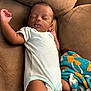 baby, sleeping, infant, onesie, couch, blanket, peaceful, resting, child, indoor, relaxing, young, cozy, soft, cute, person, portrait, furniture, comfort, nap