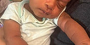 Xavier is registered to the contest to win money with this photo: baby, sleeping, infant, person, hand, arm, clothing, indoor, couch, skin, closeup, comfort, rest, cute, newborn, human, relaxation, toddler, peaceful, portrait