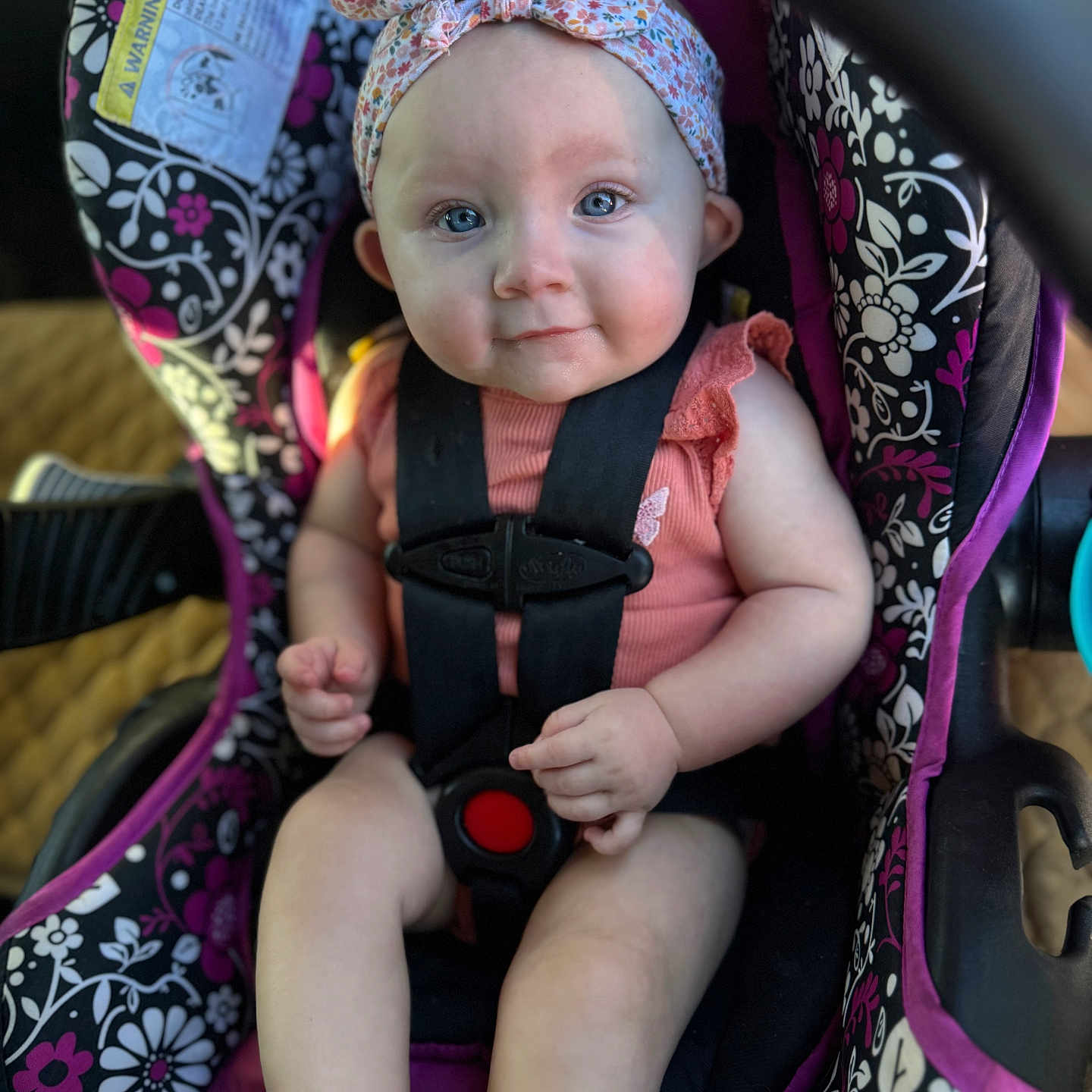 Aurora is registered to the contest to win money with this photo: accessories, baby, bodypart, bonnet, cap, car, car_interior, carseat, clothing, face, finger, hand, hat, head, homedecor, person, photography, portrait, transportation, vehicle