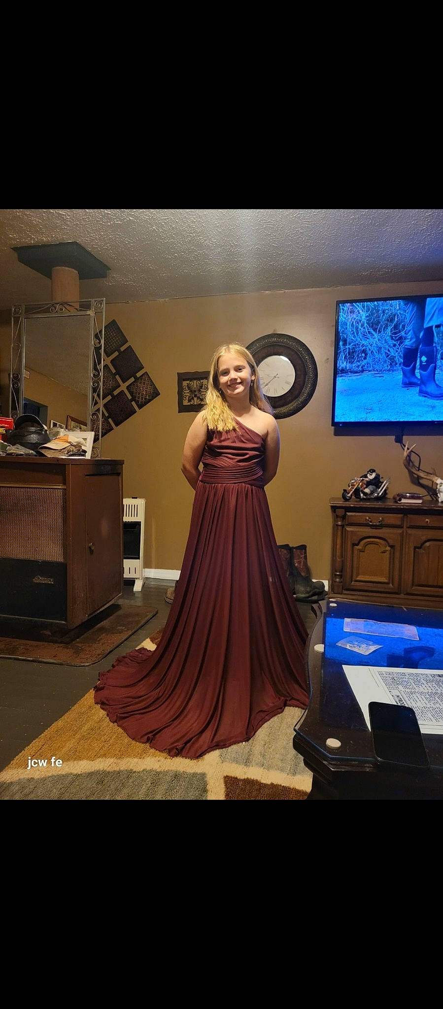 Brianna is registered to the contest to win money with this photo: art, bridal_party_dress, costume_design, drawer, event, fashion_design, fashion_model, flash_photography, flooring, formal_wear, gown, haute_couture, home_appliance, joy, one_piece_garment, person, purple, room, standing, television