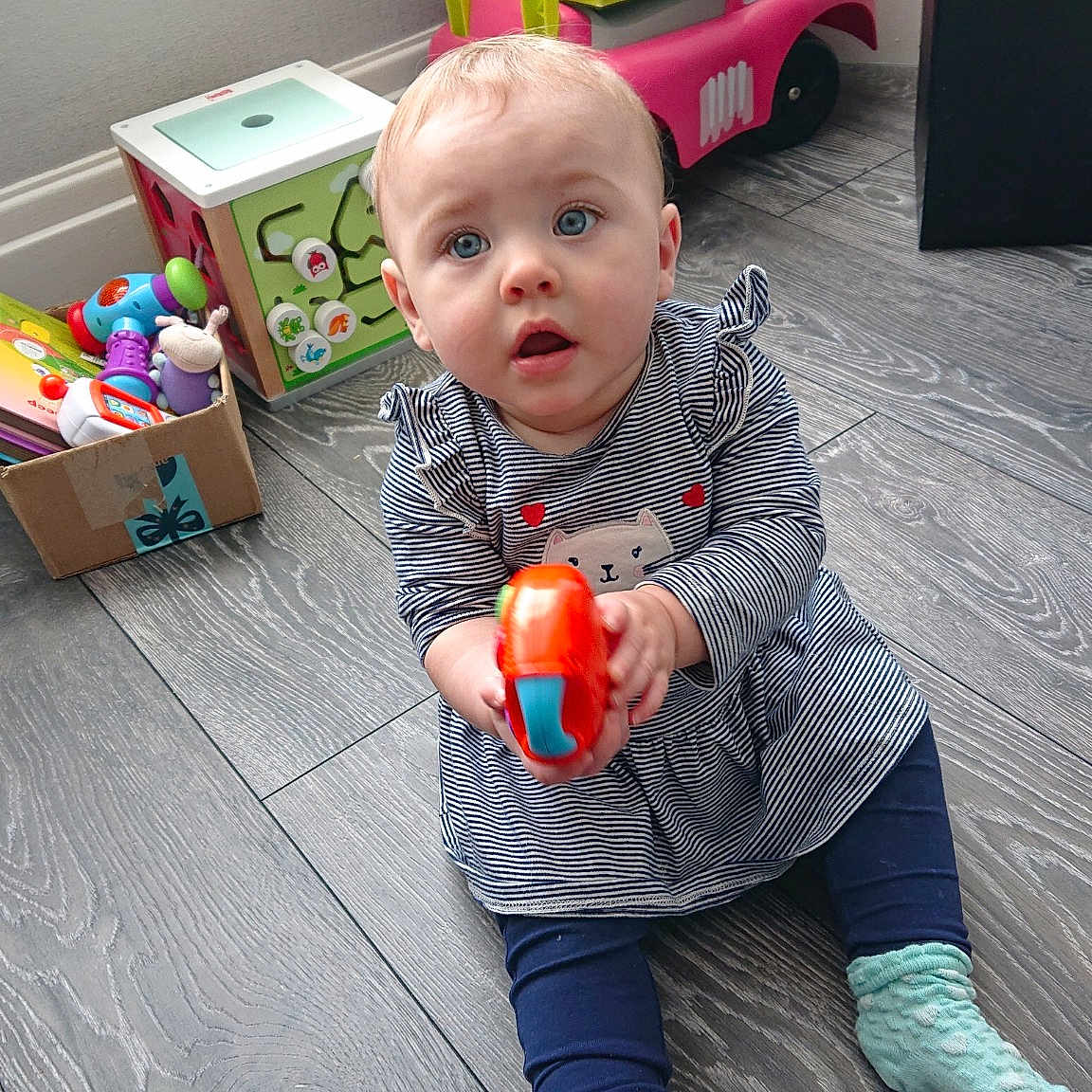 Maisie joined the competition — help win amazing prizes! baby, baby_toys, child, fun, leg, person, play, room, sitting, smile, surprise, toddler, toy