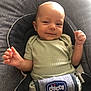 baby, infant, smile, child, seat, carseat, clothing, green_shirt, happy, indoor, person, young_child, baby_gesture, baby_face, baby_hands, fabric, cushion, baby_seat, chicco_brand, comfortable