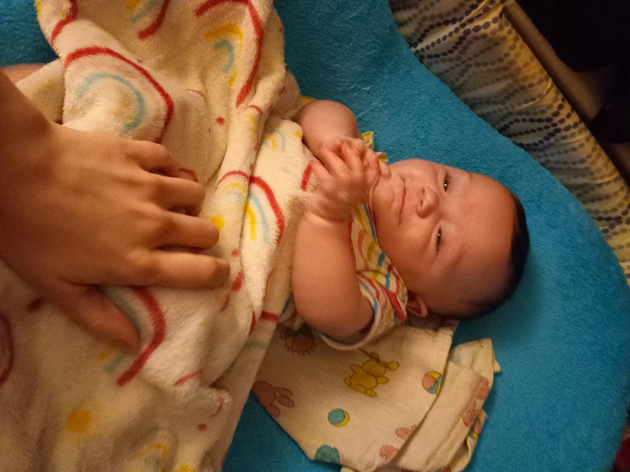 Mila Lousie Ross is registered to the contest to win money with this photo: abdomen, baby, baby_toddler_clothing, bedtime, cheek, child, comfort, elbow, finger, gesture, human_body, linens, mouth, nail, nose, pattern, person, skin, thumb, toddler