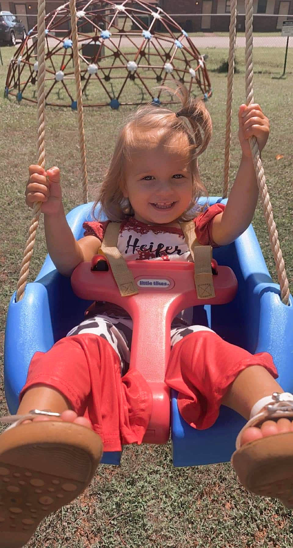 Madalynn joined the competition — help win amazing prizes! baby_toddler_clothing, blue, child, eye, facial_expression, finger, fun, hand, happy, human_body, joy, lap, leisure, person, playground, public_space, recreation, skin, smile, summer