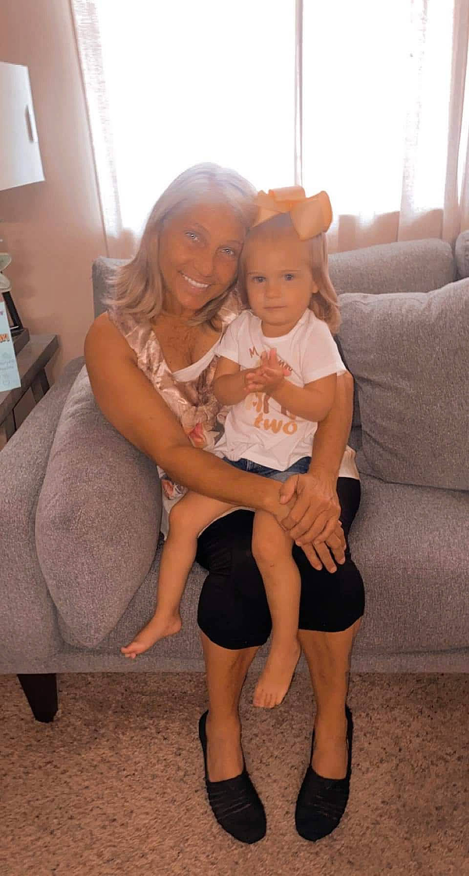 Madalynn joined the competition — help win amazing prizes! abdomen, blond, comfort, couch, eye, happy, human_body, human_leg, iris, joy, knee, lap, leg, person, shoulder, skin, smile, thigh, toddler, trunk