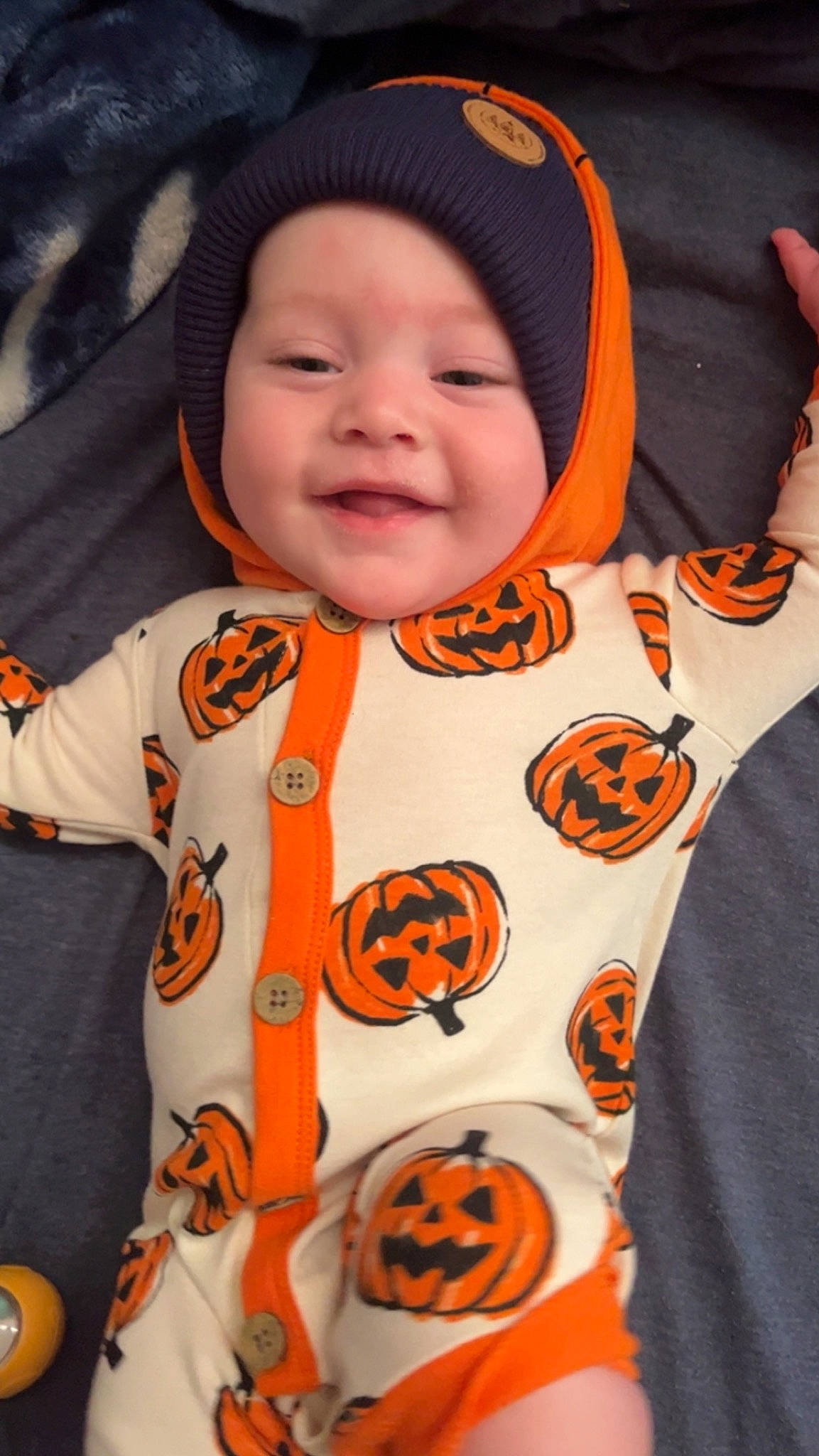 Kyson joined the competition — help win amazing prizes! baby, baby_toddler_clothing, black, cheek, child, eye, facial_expression, fun, happy, head, headgear, headwear, mammal, mouth, orange, organ, person, skin, sleeve, smile