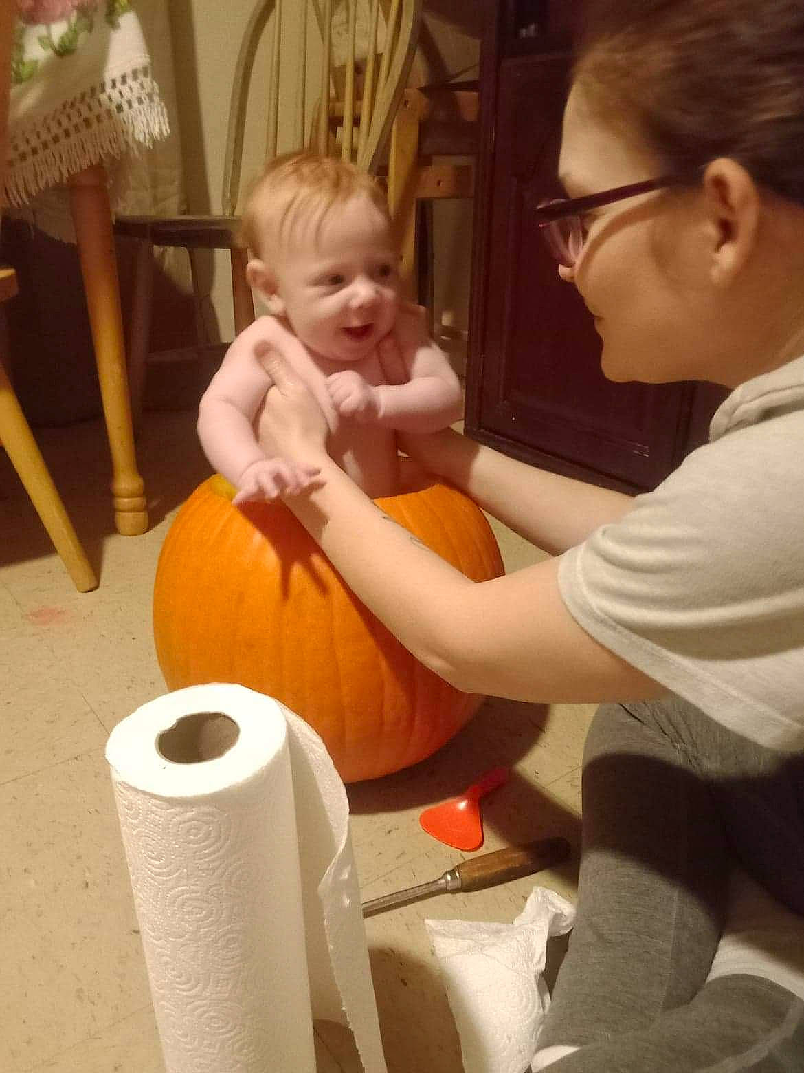 Lilith is registered to the contest to win money with this photo: art, baby, chair, child, comfort, cylinder, fun, glasses, happy, household_supply, human_leg, nail, organ, paper_towel, person, room, sitting, smile, tissue_paper, toddler