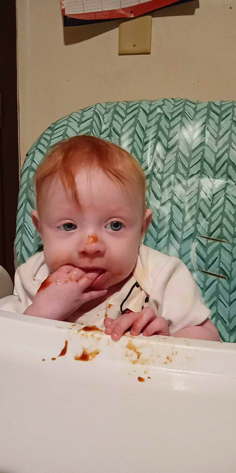 Lilith is registered to the contest to win money with this photo: baby, baby_playing_with_food, baby_toddler_clothing, cheek, child, comfort, comfort_food, food, iris, linens, lip, mouth, nose, person, sitting, skin, sleeve, sweetness, textile, toddler