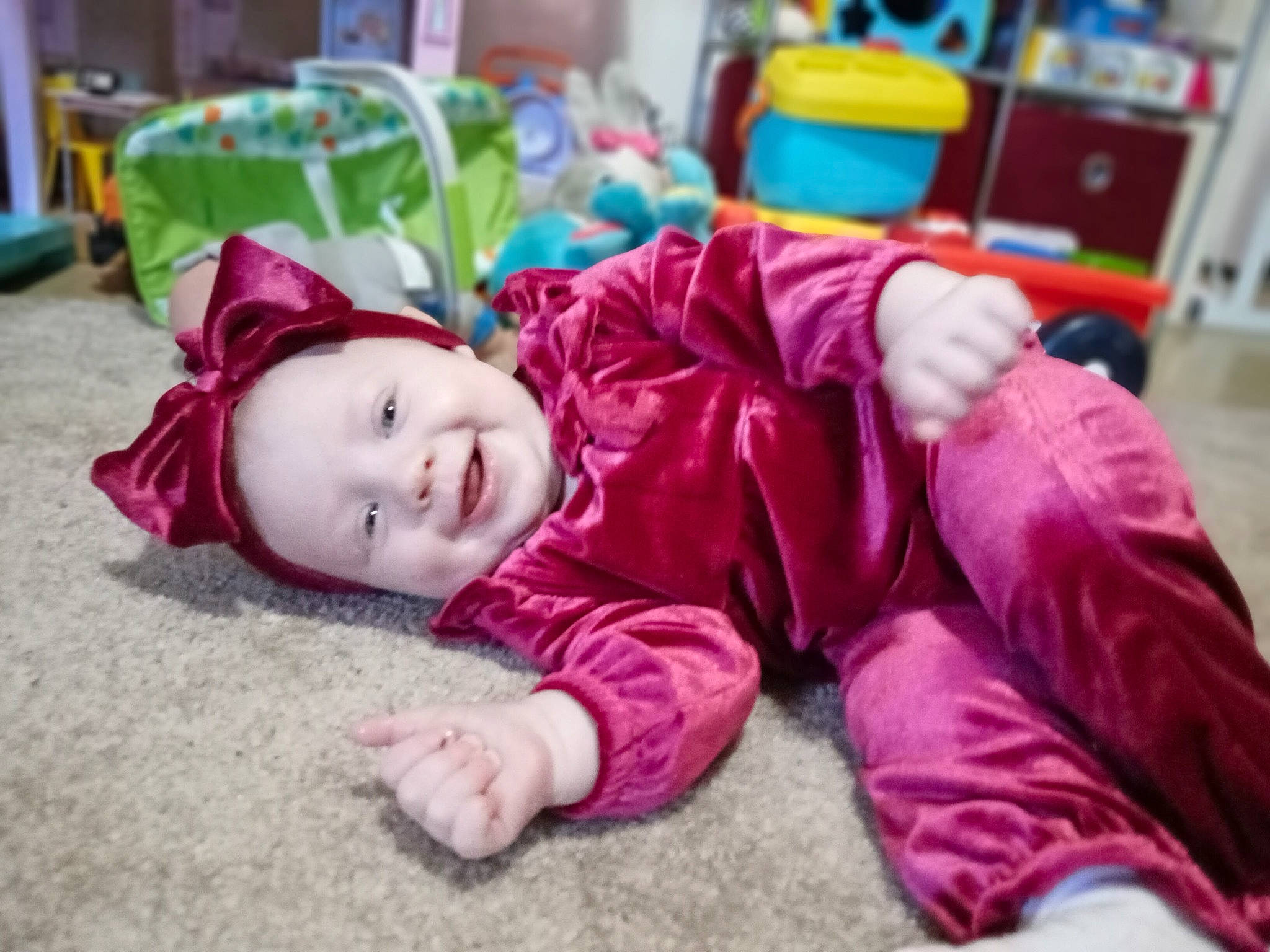 Lilith joined the competition — help win amazing prizes! baby, baby_toddler_clothing, child, comfort, flooring, fun, grass, happy, headwear, joy, leisure, magenta, person, pink, portrait_photography, purple, room, shelf, sitting, smile