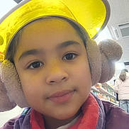 Chelsea Opingo Calsas is registered to the contest to win money with this photo: casual, child, coat, cute, earmuffs, face, headwear, indoor, person, portrait, retail, scarf, selfie, shelf, shopping, store, warm, winter_clothing, yellow_visor, young