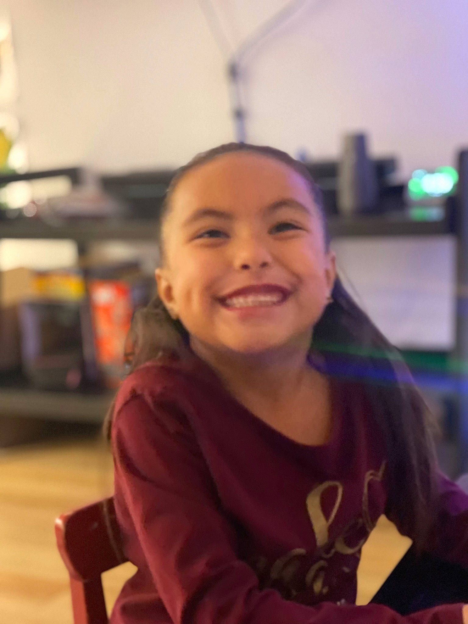 Samaria joined the competition — help win amazing prizes! chair, child, event, flooring, fun, happy, hoodie, joy, laugh, leisure, long_hair, person, recreation, room, sitting, smile, t_shirt, vacation