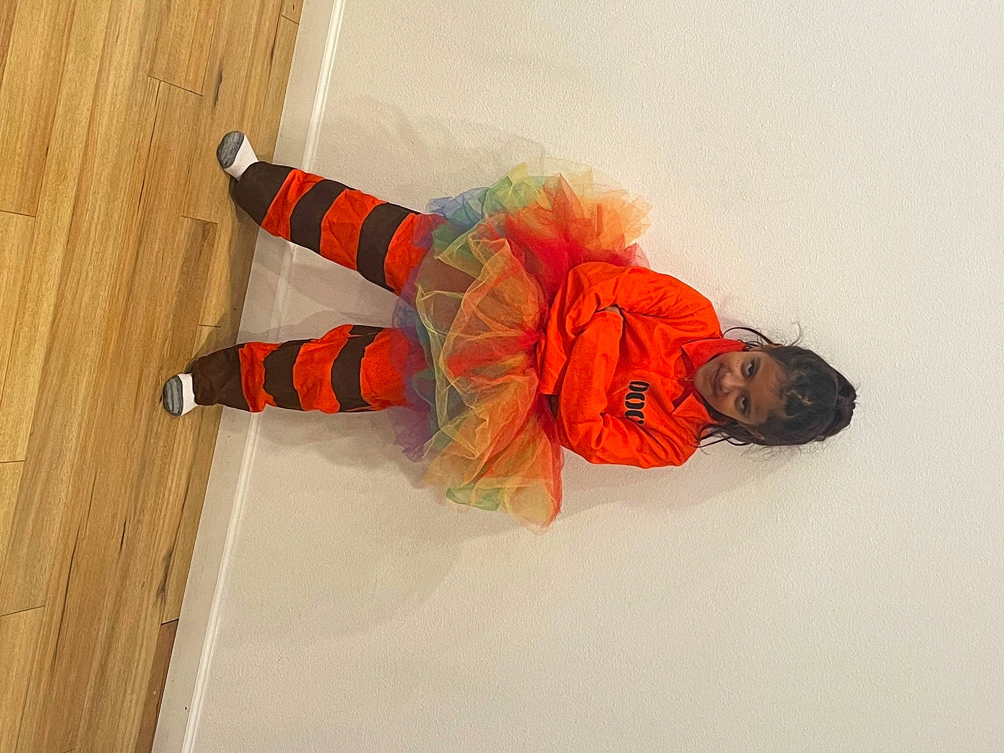 Amia joined the competition — help win amazing prizes! art, carmine, costume, fashion_accessory, flooring, fun, graphics, hardwood, illustration, joy, knee, orange, pattern, person, personal_protective_equipment, sports_gear, visual_arts, wood