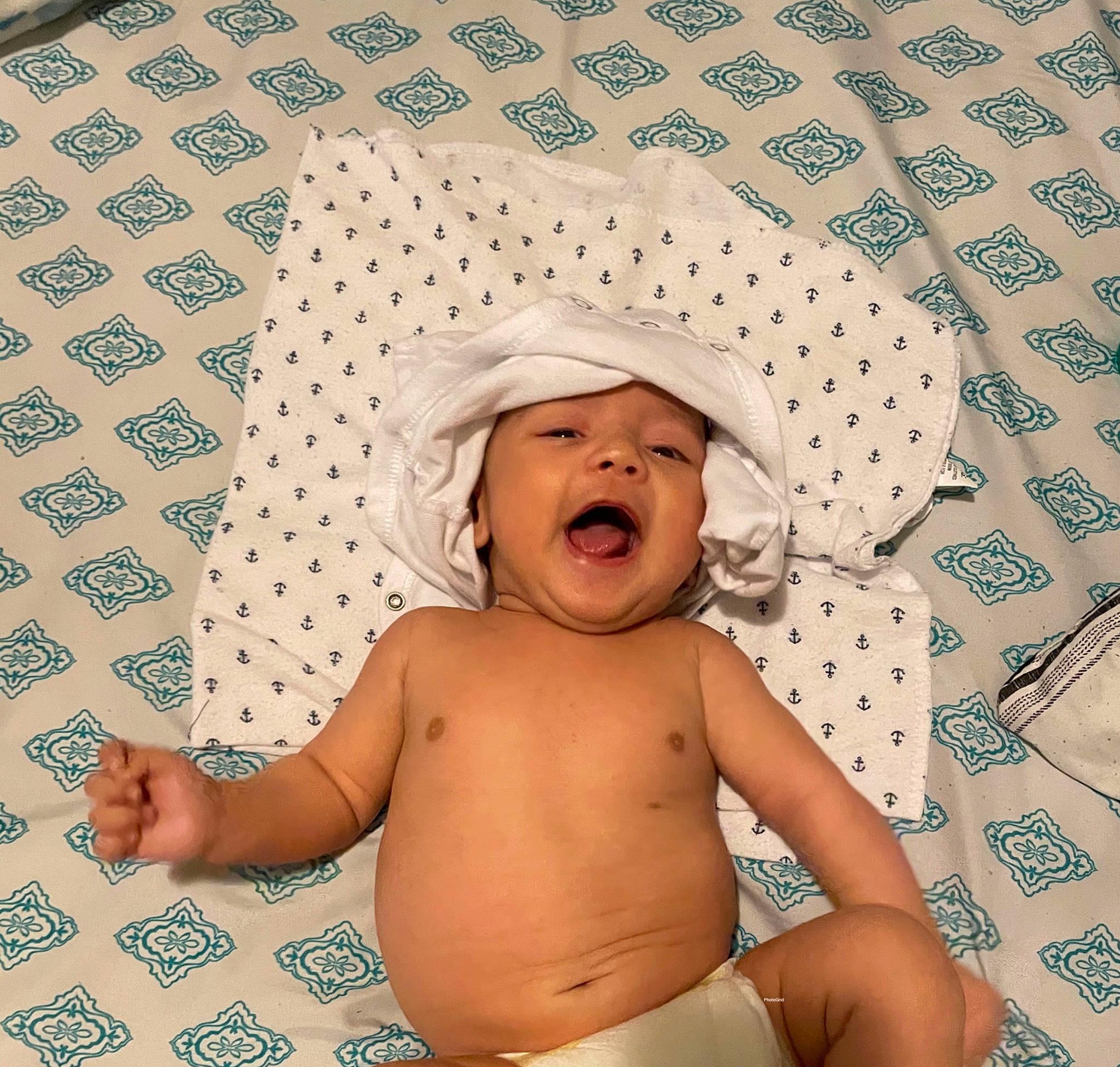 Lucas is registered to the contest to win money with this photo: azure, baby, baby_sleeping, baby_toddler_clothing, chest, child, comfort, facial_expression, finger, happy, hat, headgear, headwear, linens, pattern, people, person, smile, stomach, textile