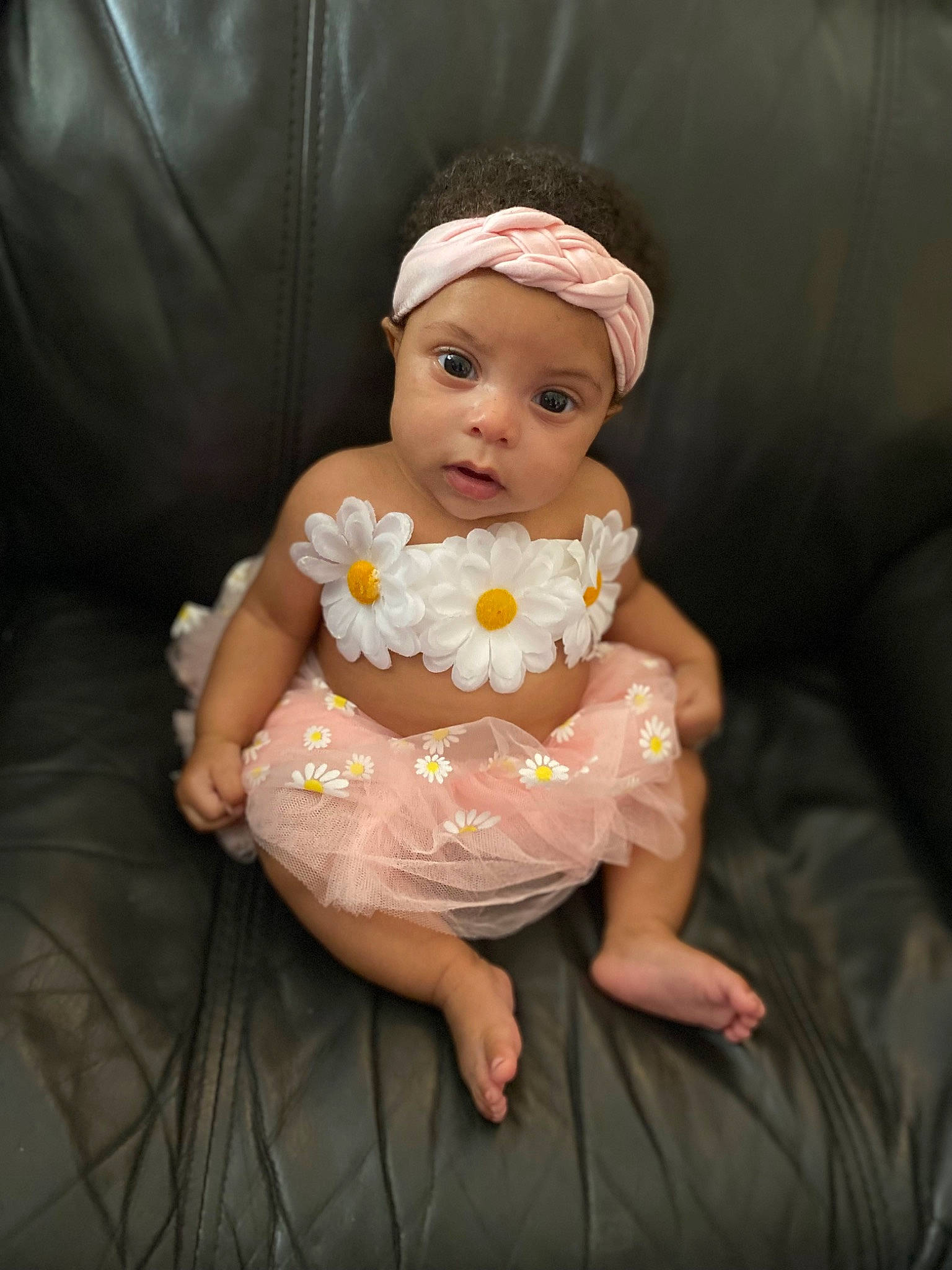 Blair is registered to the contest to win money with this photo: baby, baby_products, baby_toddler_clothing, cheek, comfort, costume, dress, event, eye, face, flash_photography, fun, happy, headpiece, headwear, human_body, iris, lap, person, sitting