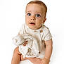 baby, infant, child, onesie, blanket, sitting, cute, curious, soft, white_background, portrait, small_hands, large_eyes, foot, skin, clothing, studio_photo, adorable, young, expression