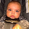 Stori joined the competition — help win amazing prizes! baby, infant, face, eyes, car_seat, safety_harness, clothing, onesie, chubby_cheeks, hand, close_up, portrait, indoor, child, cute, expression, fabric, seat, cute_baby, newborn