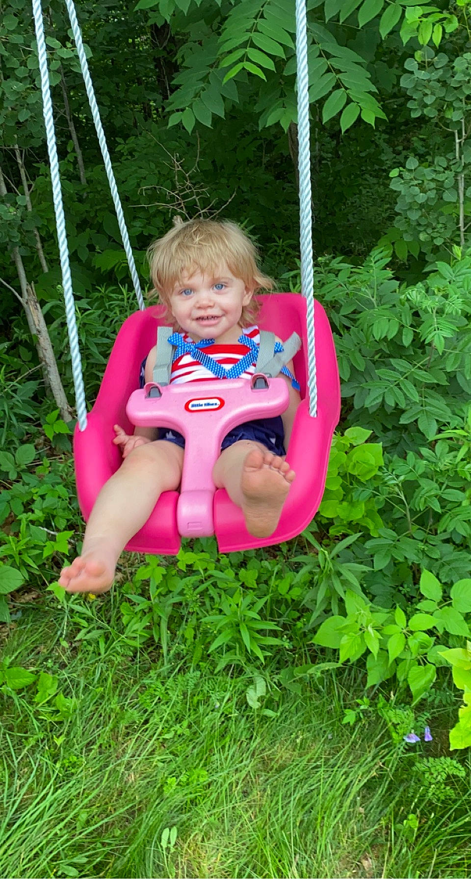 Avery joined the competition — help win amazing prizes! baby_toddler_clothing, child, electric_blue, fun, grass, green, hair, happy, joy, leisure, outdoor_play_equipment, people_in_nature, person, pink, plant, playground, recreation, sitting, summer, swing