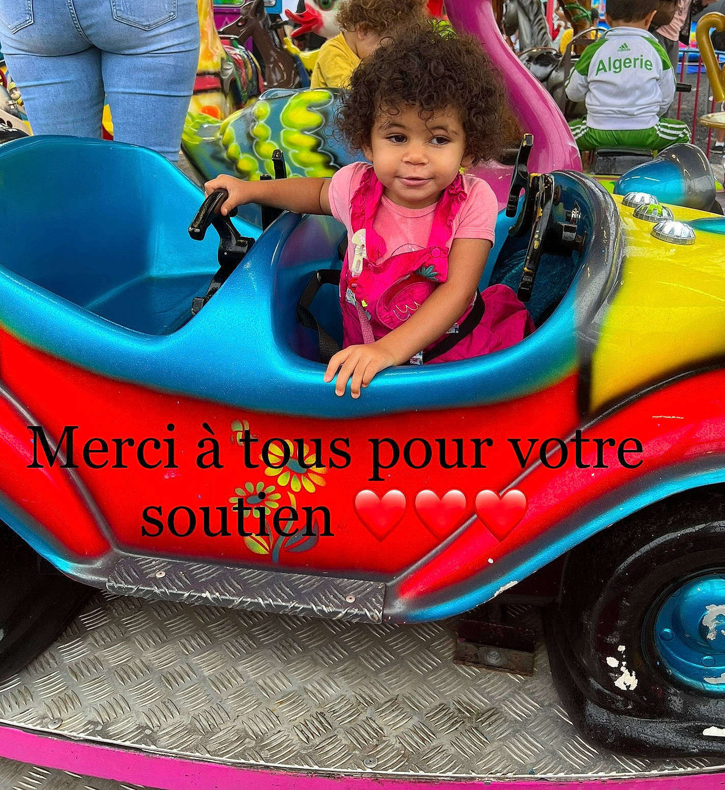 Anaïa a rejoint le concours — aidez-le/la à gagner de superbes lots ! automotive_design, automotive_exterior, automotive_tire, automotive_wheel_system, blue, bumper, car, fun, green, mode_of_transport, motor_vehicle, people, person, pink, riding_toy, shirt, tire, toddler, toy, vehicle