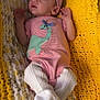 Liliana joined the competition — help win amazing prizes! baby, infant, blanket, headband, pink_clothing, dinosaur, onesie, white_socks, newborn, cute, sleeping_area, soft_texture, resting, cozy, indoor, child, small_hands, knit_blanket, yellow_blanket, patterned_blanket