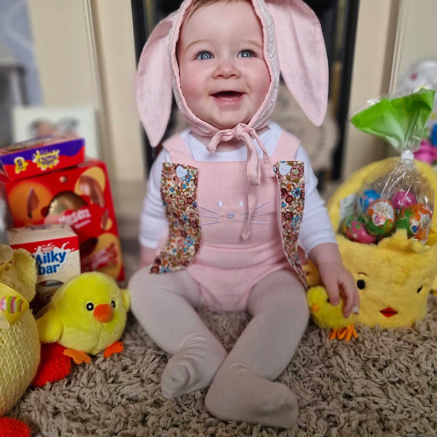 Maizie-Kate joined the competition — help win amazing prizes! architecture, baby, bonnet, building, cap, clothing, costume, face, hat, head, homedecor, hosiery, pants, person, photography, plush, portrait, sitting, sock, toy