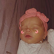 Celina is registered to the contest to win money with this photo: baby, sleeping, headband, pink, bow, infant, clothing, white, face, closed_eyes, cute, neon, crescent_moon, glowing, soft, fabric, resting, peaceful, portrait, child