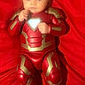 baby, infant, costume, iron_man, superhero, red, fabric, lying_down, child, face, person, portrait, cute, small, hands, feet, bright, colorful, soft, clothing