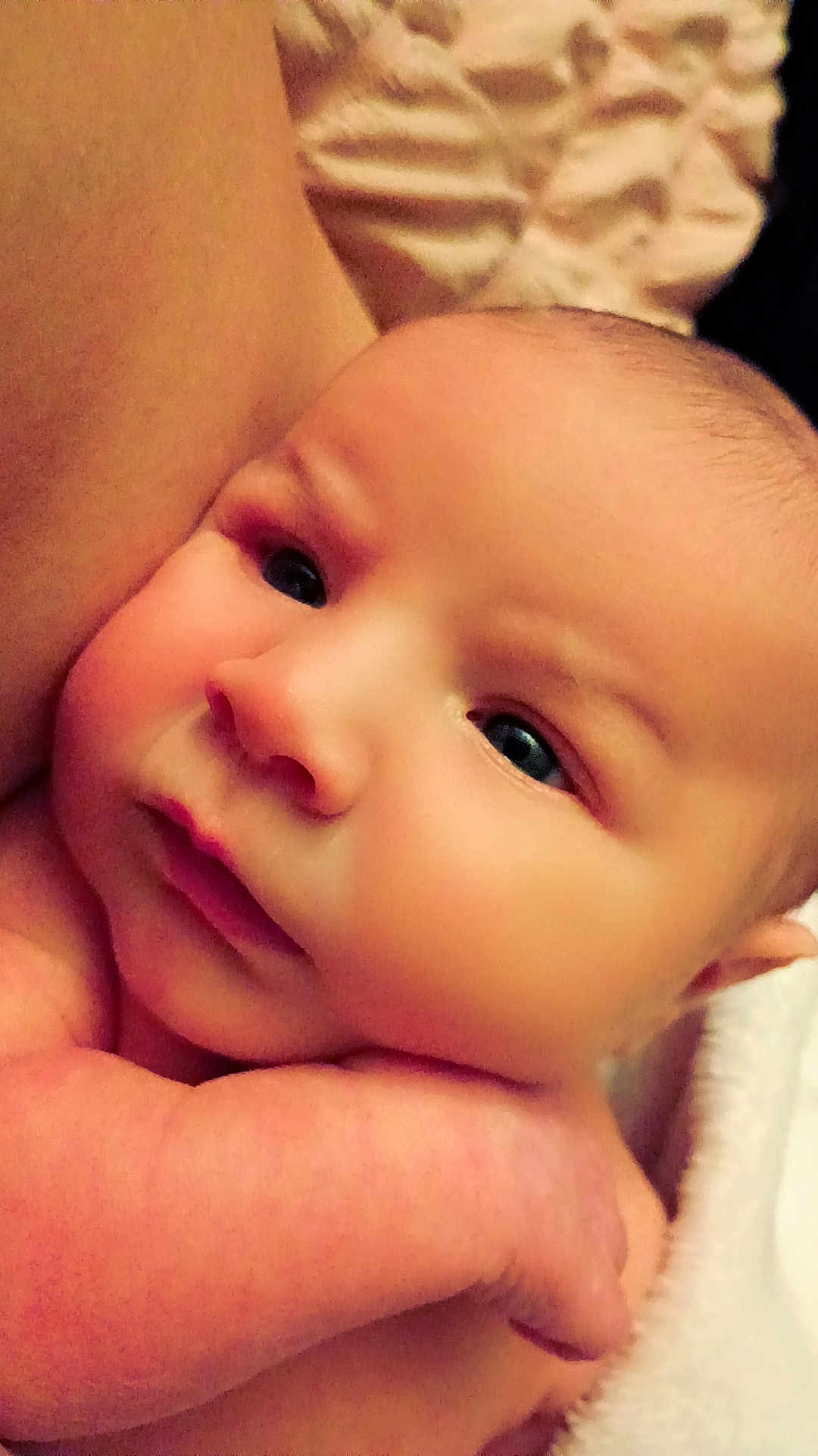 Za'Kiyah is registered to the contest to win money with this photo: baby, infant, newborn, face, cheeks, eyes, arm, hand, skin, close_up, portrait, cuddling, blanket, soft_light, indoors, adorable, gaze, sleepy, parental_touch, rosy_cheeks