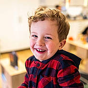 Oliver joined the competition — help win amazing prizes! child, boy, smiling, face, curly_hair, hoodie, red_clothing, indoor, people, background_blur, happy, portrait, casual_clothing, childhood, young, candid, person, cute, warm_lighting, playroom