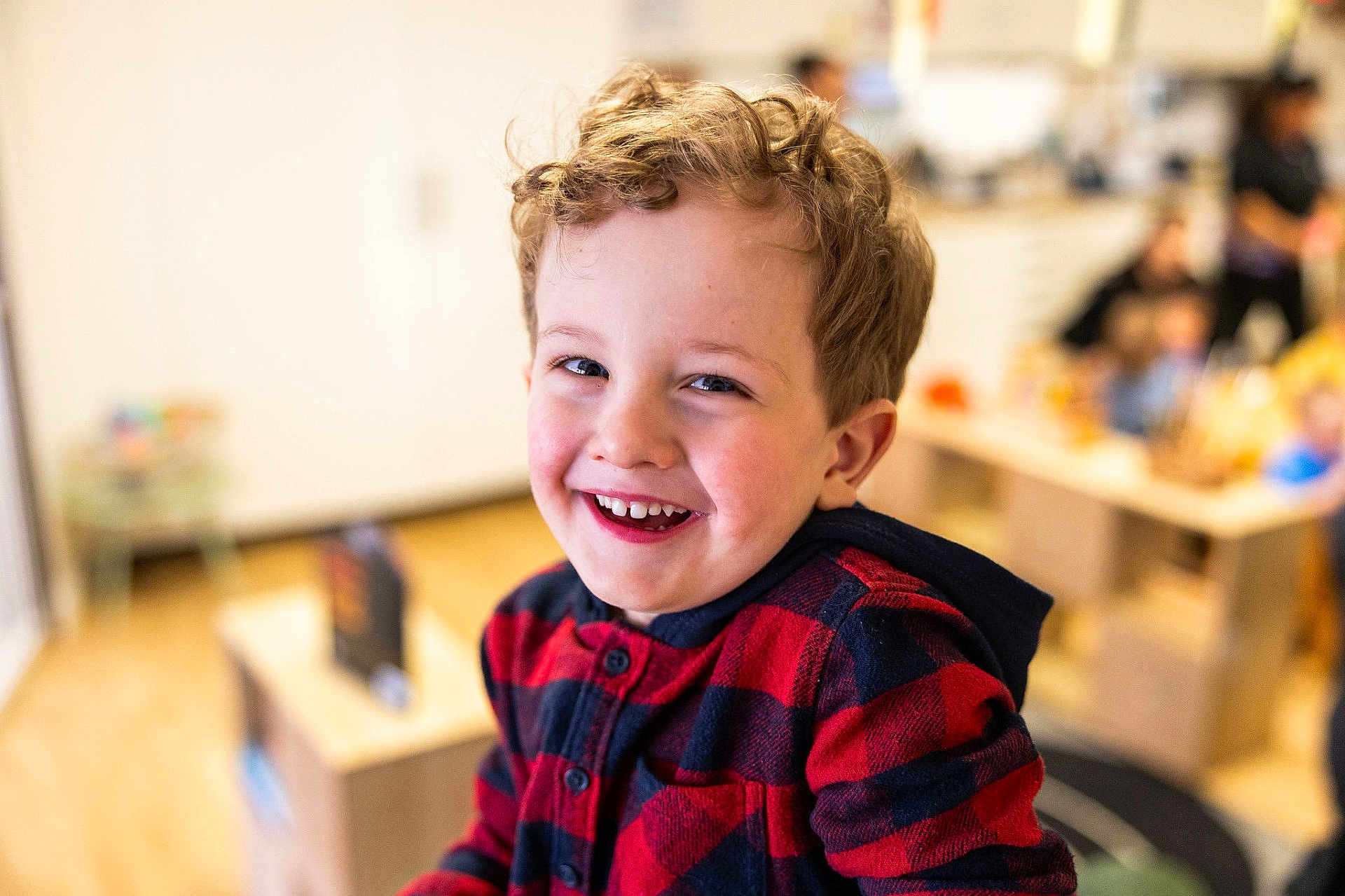 Oliver joined the competition — help win amazing prizes! child, boy, smiling, face, curly_hair, hoodie, red_clothing, indoor, people, background_blur, happy, portrait, casual_clothing, childhood, young, candid, person, cute, warm_lighting, playroom