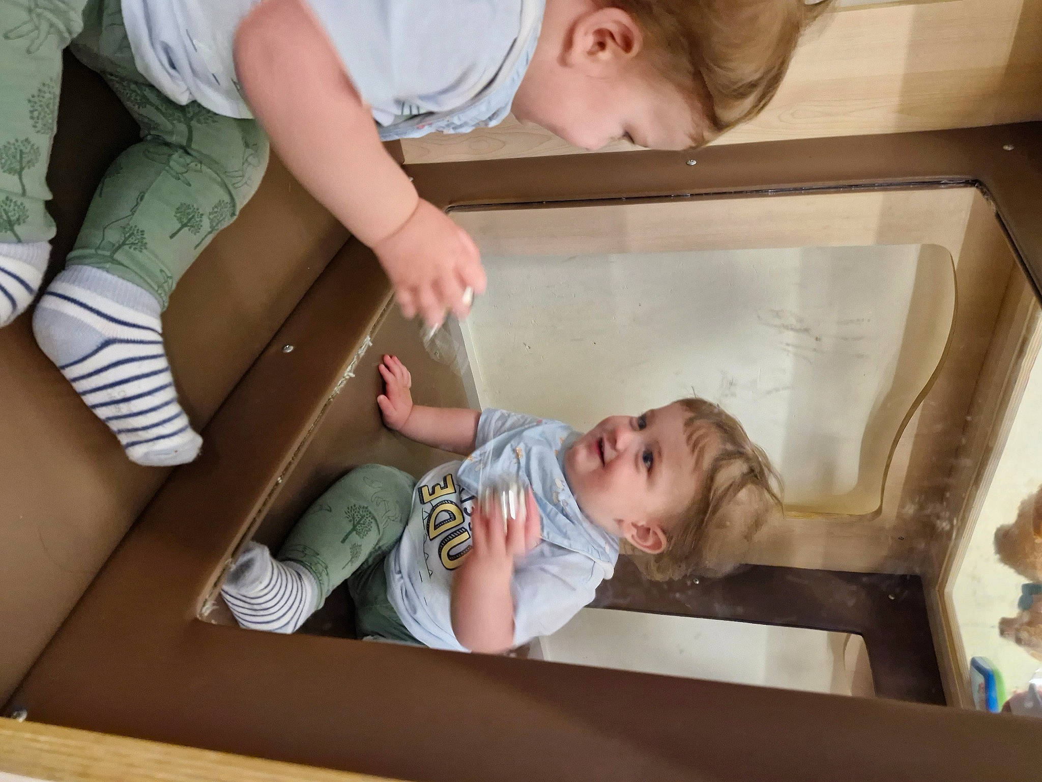 Oliver is registered to the contest to win money with this photo: baby, baby_products, baby_toddler_clothing, child, comfort, cooking, foot, fun, gesture, happy, joy, leisure, pattern, person, play, room, shorts, sitting, sock, t_shirt