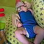 Cyriak participe au concours pour gagner de l'argent avec cette photo : baby, pacifier, blue_clothing, green_cushion, patterned_fabric, stuffed_toy, glove, sleeping, infant, diaper, bracelet, indoor, soft_toy, hand, legs, cute, resting, child, comfort, nap