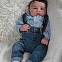 baby, infant, child, denim_jeans, suspenders, blue_shirt, white_socks, blanket, fluffy, soft_texture, lying_down, portrait, indoors, cute, clothing, face, expression, hands, feet, comfort