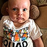 baby, infant, tshirt, plush_toy, stuffed_animal, sitting, wide_eyes, expression, indoor, face, person, child, cute, clothing, soft_toy, colorful, closeup, portrait, skin, young