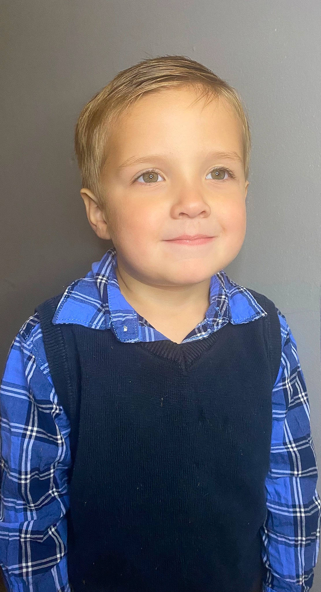 Lyle is registered to the contest to win money with this photo: blue, cheek, child, chin, collar, dress_shirt, electric_blue, flash_photography, formal_wear, iris, joy, neck, pattern, person, plaid, sleeve, smile, standing, t_shirt, tartan