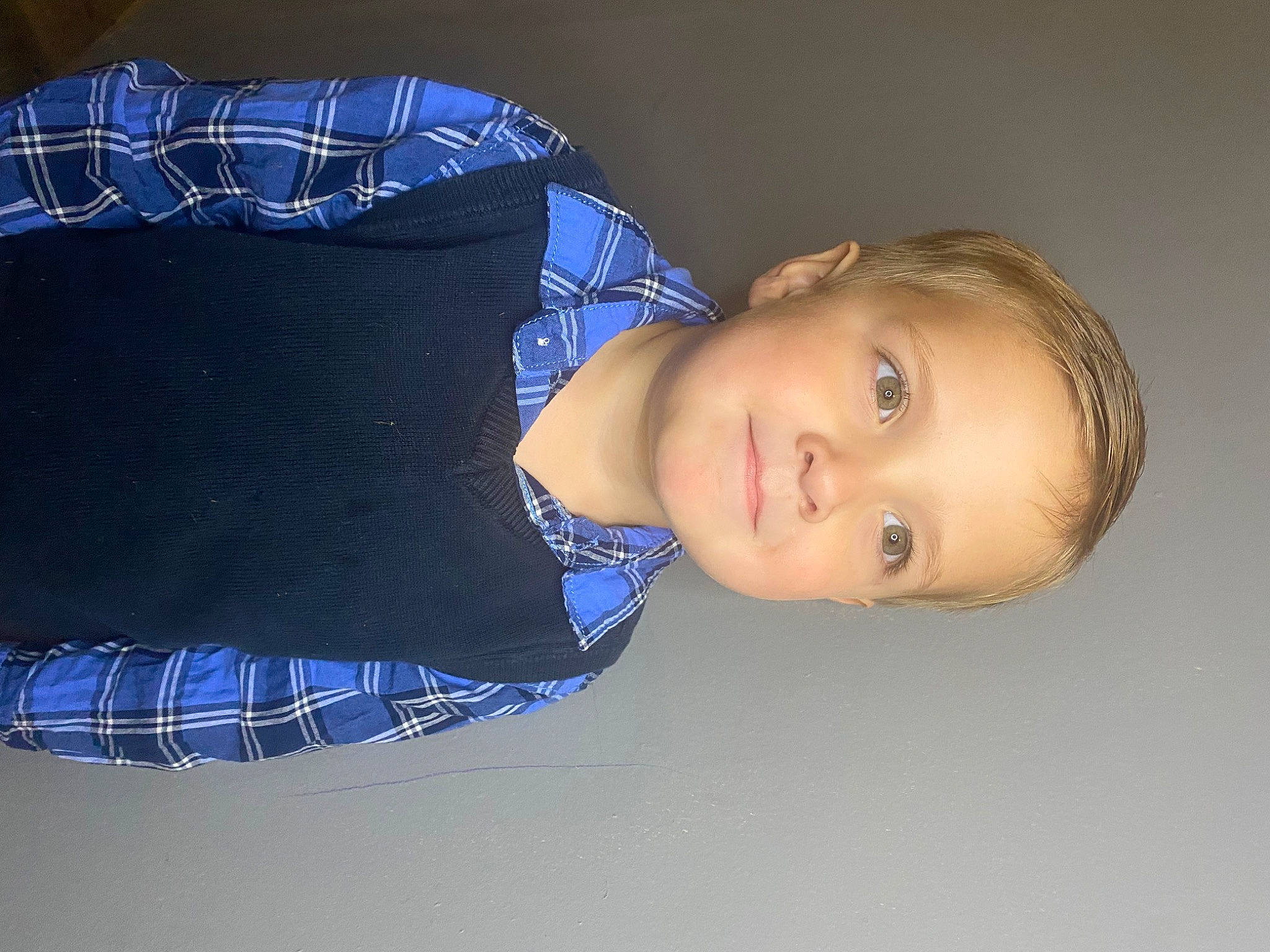 Lyle is registered to the contest to win money with this photo: arm, child, comfort, denim, elbow, electric_blue, eyelash, flash_photography, joy, knee, pattern, person, plaid, portrait_photography, sitting, sleeve, tartan, textile, toddler, wrist