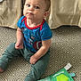 Wylder is registered to the contest to win money with this photo: baby, blue_shirt, captain_america, carpet, child, colorful, curious, educational_toy, expression, floor, green_pants, indoor, learning, pattern, play, shirt, sitting, toddler, toy, young_child