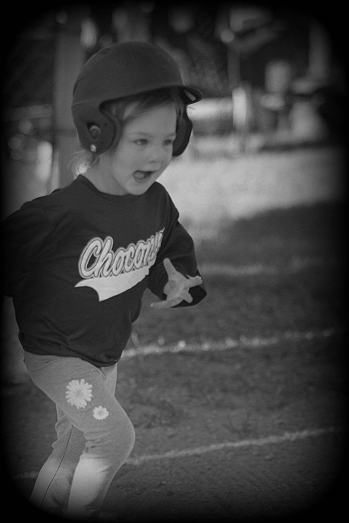 Waylynn is registered to the contest to win money with this photo: baseball_cap, black_and_white, cap, cool, eye, flash_photography, happy, head, headgear, human_body, monochrome, person, personal_protective_equipment, player, smile, sports_equipment, sports_gear, style, t_shirt, tints_and_shades
