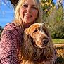 Véronique Bavier a rejoint le concours — aidez-le/la à gagner de superbes lots ! woman, dog, cocker_spaniel, smile, outdoor, tree, autumn, leaves, blonde_hair, portrait, sunlight, nature, casual_clothing, bracelet, watch, happy, pet, animal, grass, blue_sky