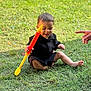 toddler, child, grass, toy, outdoor, happy, playing, sitting, person, casual_clothing, hand, greenery, daylight, smiling, barefoot, fun, leisure, summer, young_child, playtime