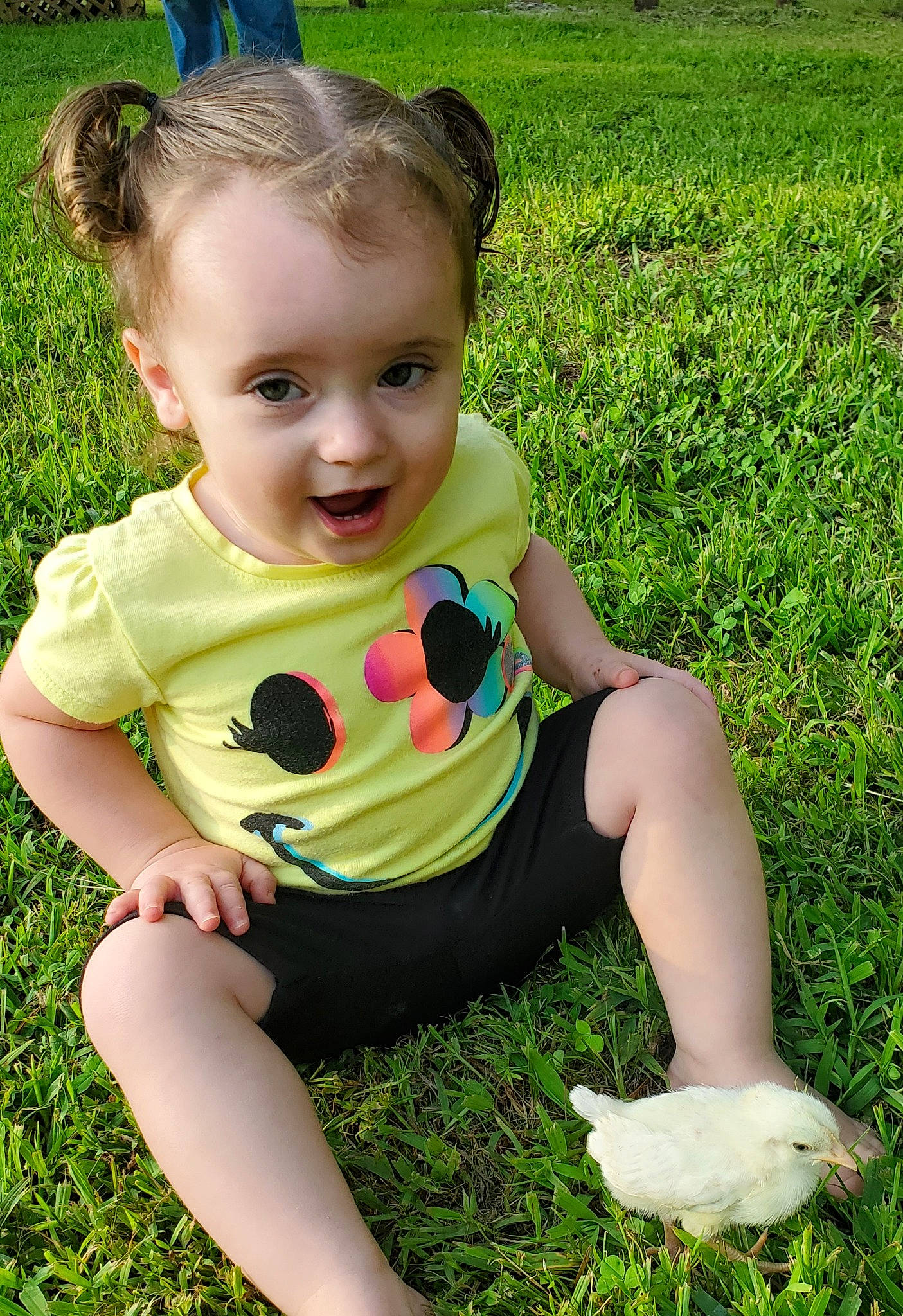 Ellie is registered to the contest to win money with this photo: baby, child, fawn, grass, grass_family, green, lawn, meadow, person, plant, play, sitting, skin, smile, toddler
