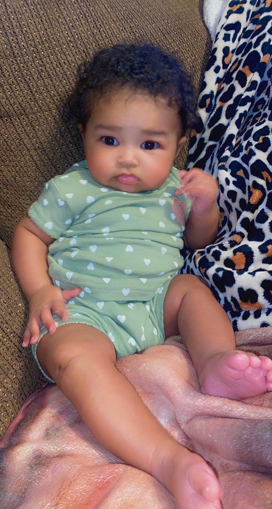 Kenleigh is registered to the contest to win money with this photo: arm, baby_toddler_clothing, cheek, chin, eye, hair, hairstyle, hand, human_body, iris, joint, leg, lip, mouth, neck, nose, organ, person, skin, sleeve