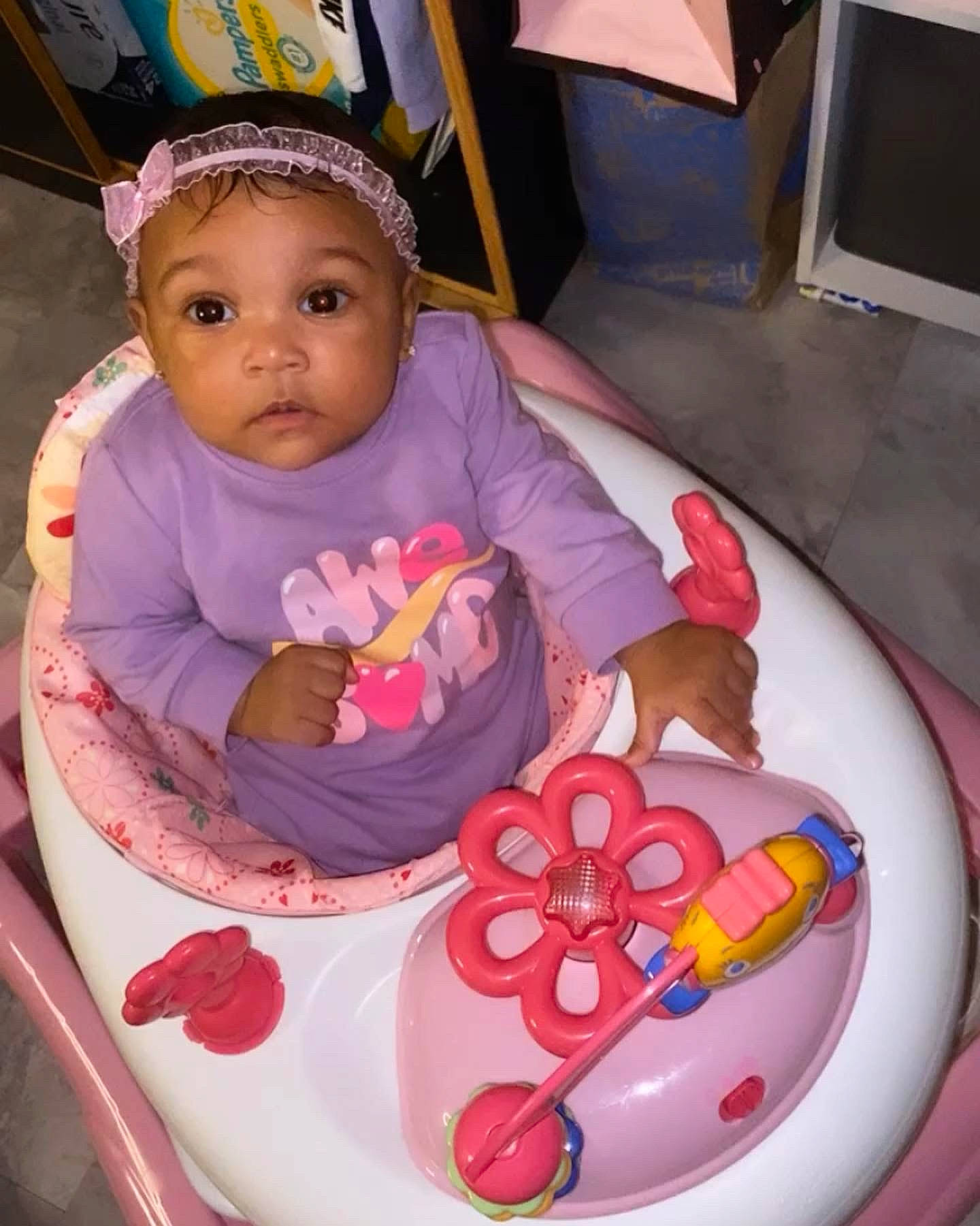 Madisyn is registered to the contest to win money with this photo: baby, baby_products, baby_toddler_clothing, cake, cake_decorating, chair, child, circle, dishware, fun, hand, happy, icing, person, pink, plate, serveware, sitting, sweetness, tableware