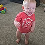 Ryler is registered to the contest to win money with this photo: toddler, child, laughing, red_tshirt, diaper, carpet, living_room, toy, furniture, happy, barefoot, person, indoor, smiling, cute, young_child, home, playful, baby, carpeted_floor
