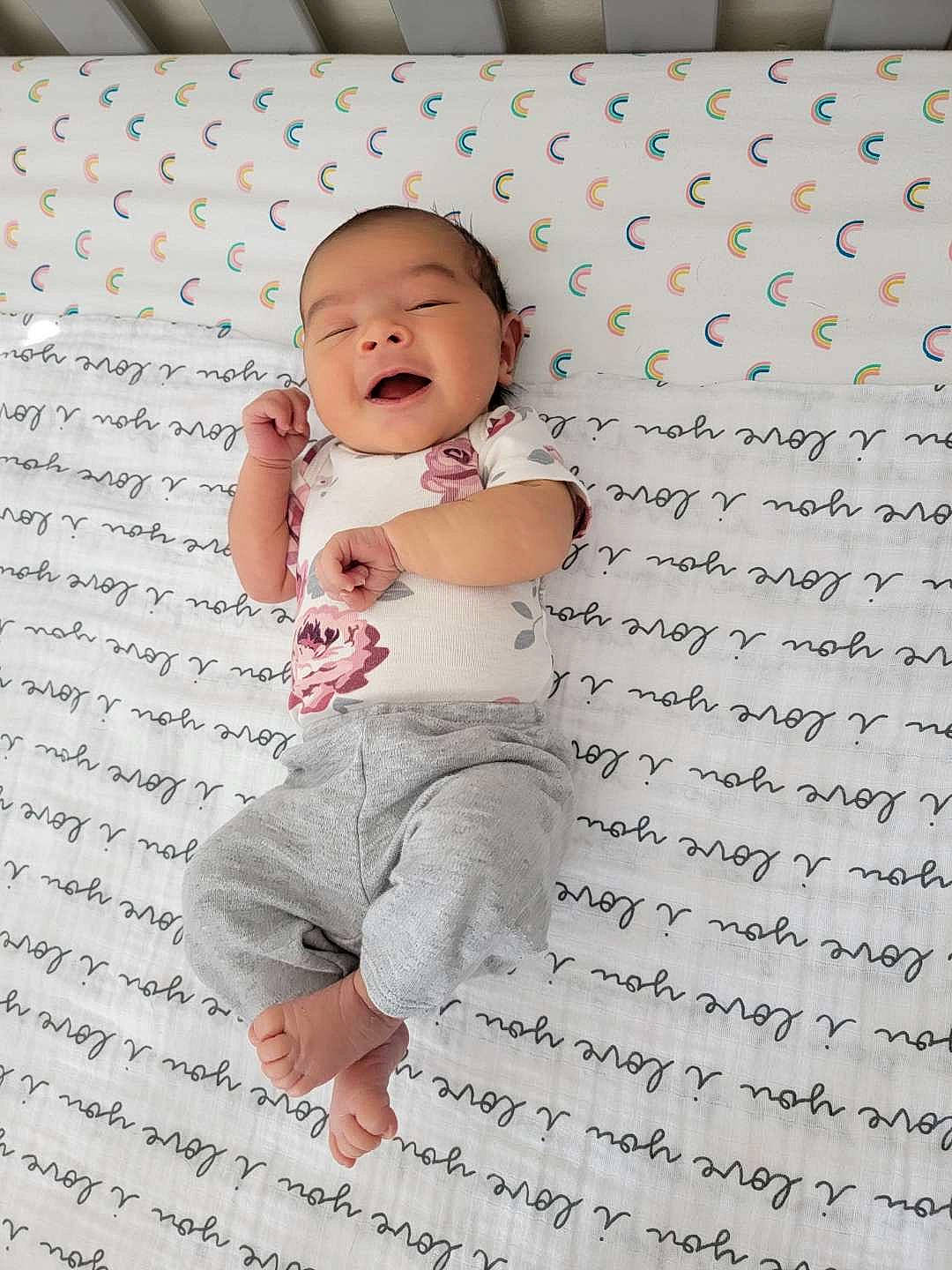 Emy is registered to the contest to win money with this photo: baby, baby_toddler_clothing, child, flash_photography, flooring, font, gesture, happy, linens, pattern, people_in_nature, person, portrait_photography, sleeve, smile, toddler